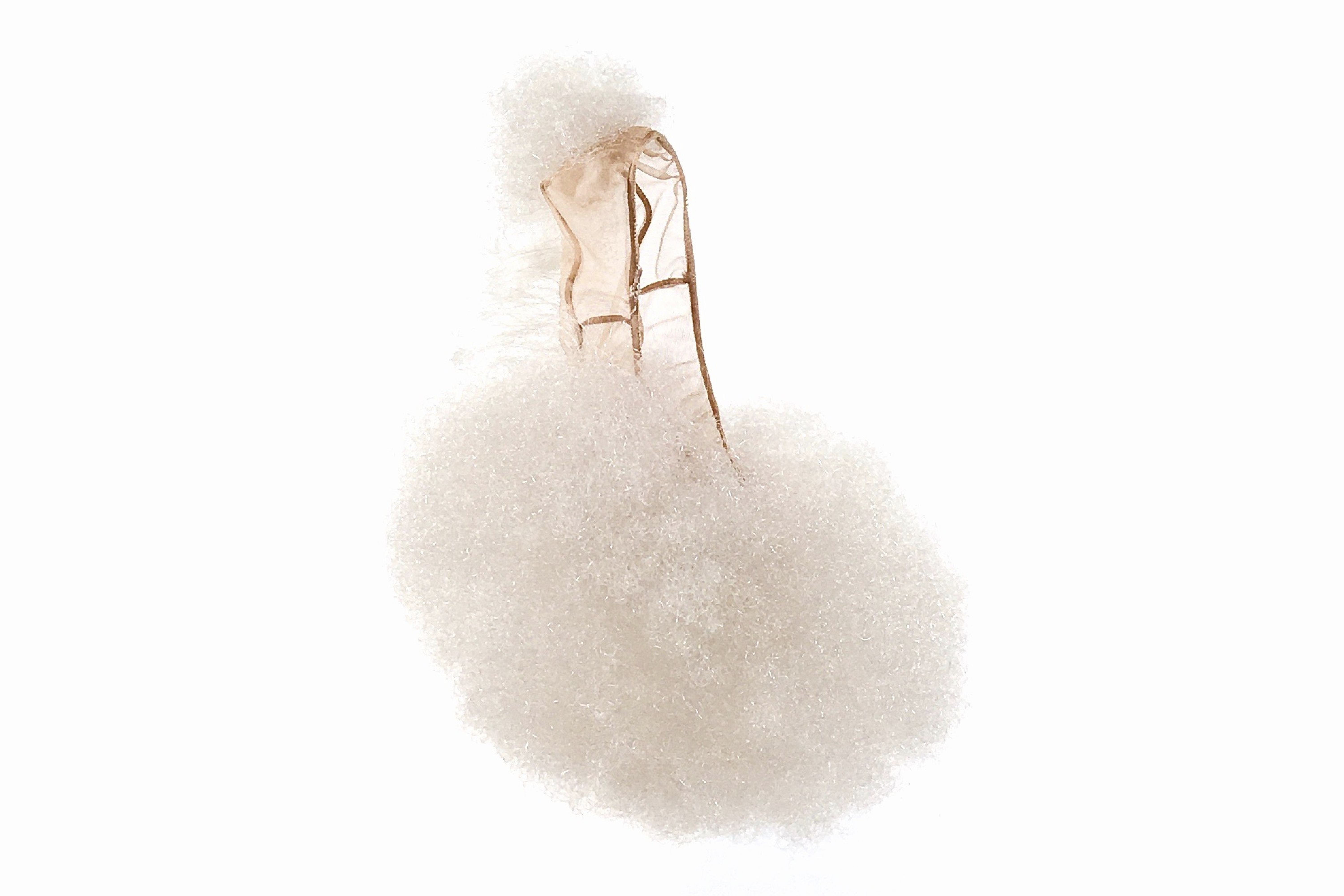 A sculptural shoe covered in soft white curls.